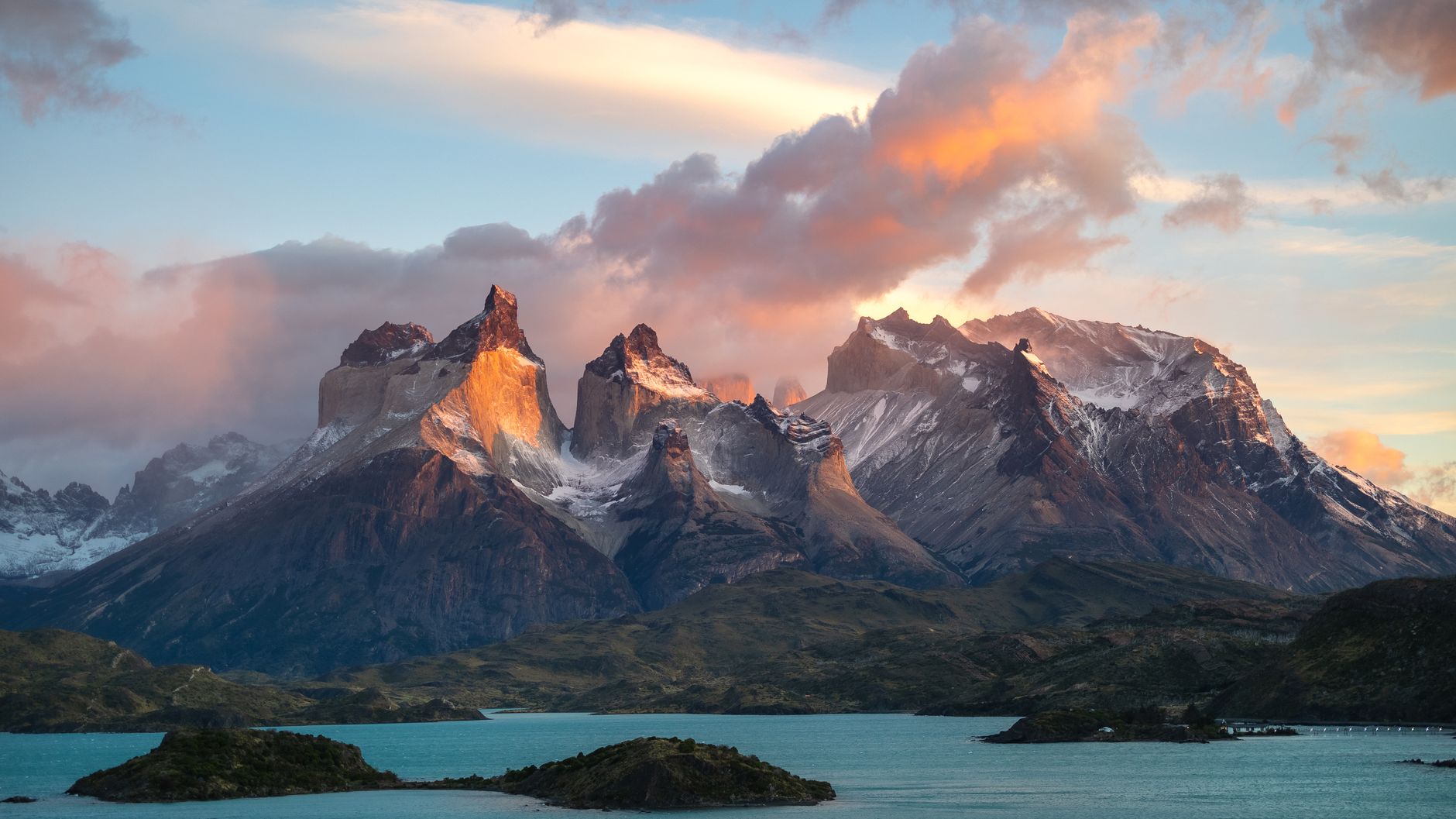 Granite peaks of Patagonia reflecting in a cold glacial river at sunset
